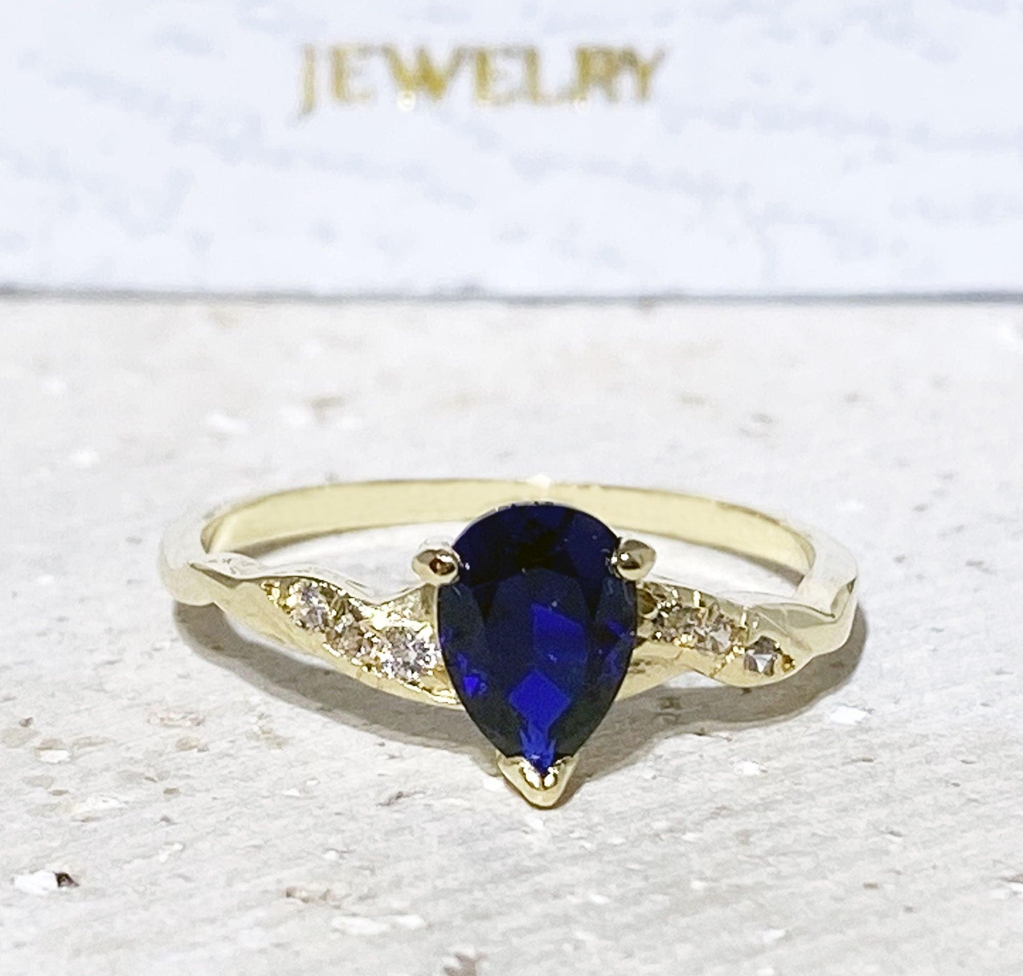 Blue Sapphire Ring - September Birthstone - Tiny Delicate Ring with Pear-Shaped Blue Sapphire Gemstone and Clear Quartz Accents - H.L.Jewelry