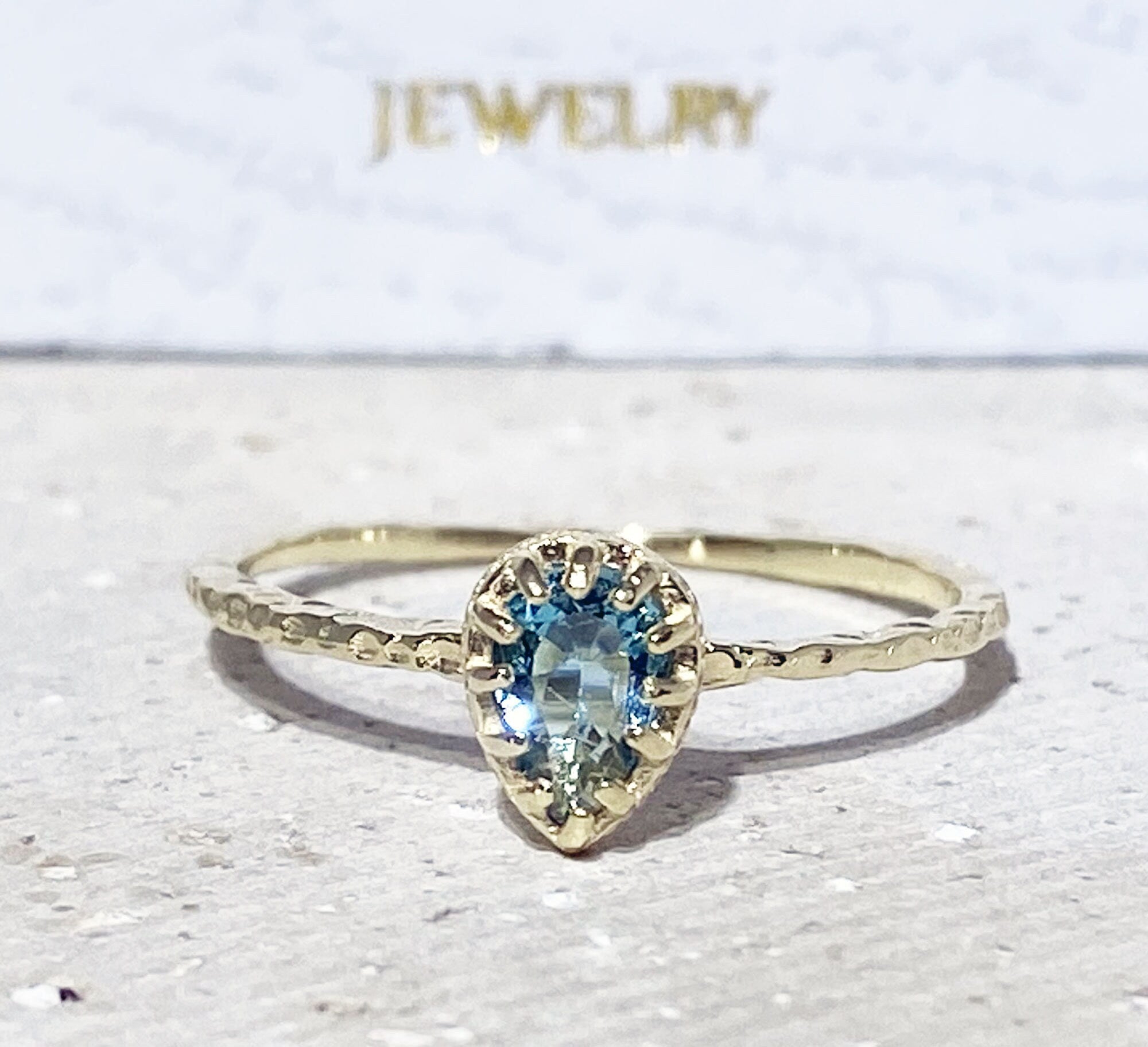 Blue Topaz Ring - December Birthstone - Delicate Hammered Ring with Pear-Shaped Blue Topaz Gemstone - H.L.Jewelry