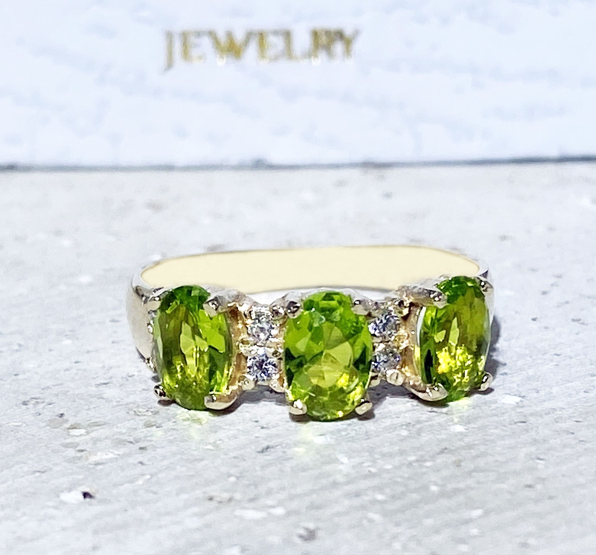 Peridot Ring - August Birthstone - Ring with Three Oval Peridot Gemstones and Clear Quartz Accents - H.L.Jewelry