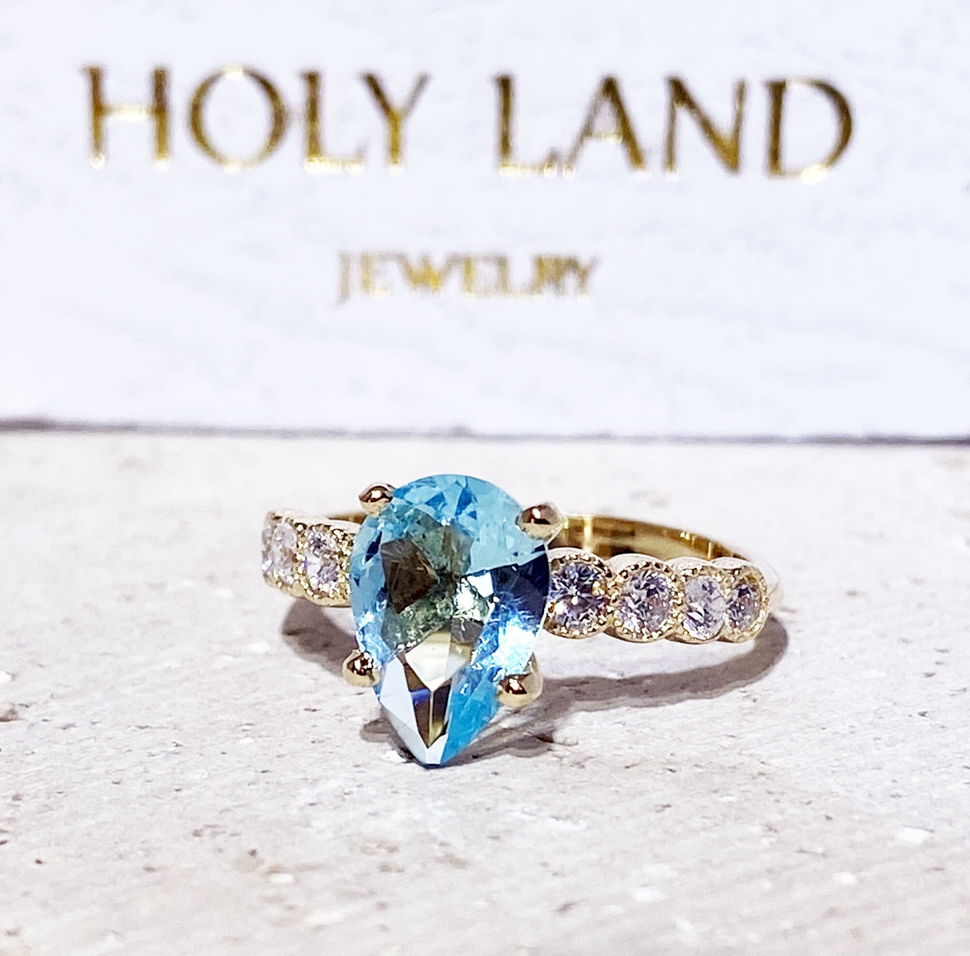 Aquamarine Ring - March Birthstone - Statement Engagement Ring with Pear-Shaped Aquamarine Gemstone and Clear Quartz Accents - H.L.Jewelry