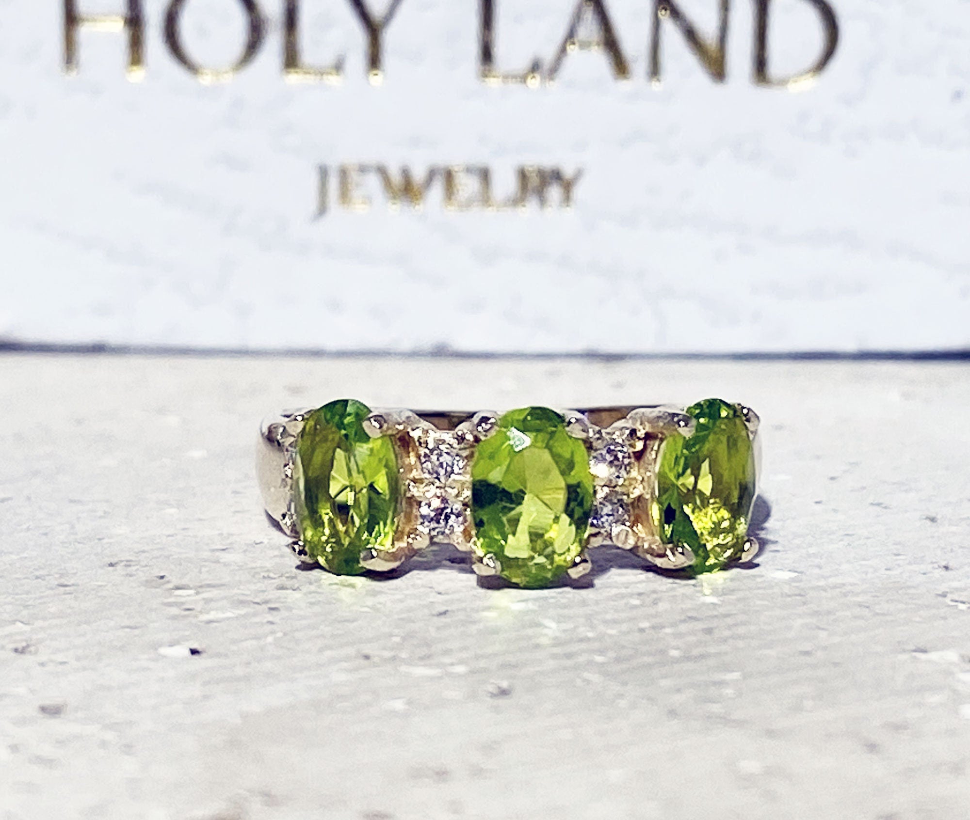 Peridot Ring - August Birthstone - Ring with Three Oval Peridot Gemstones and Clear Quartz Accents - H.L.Jewelry