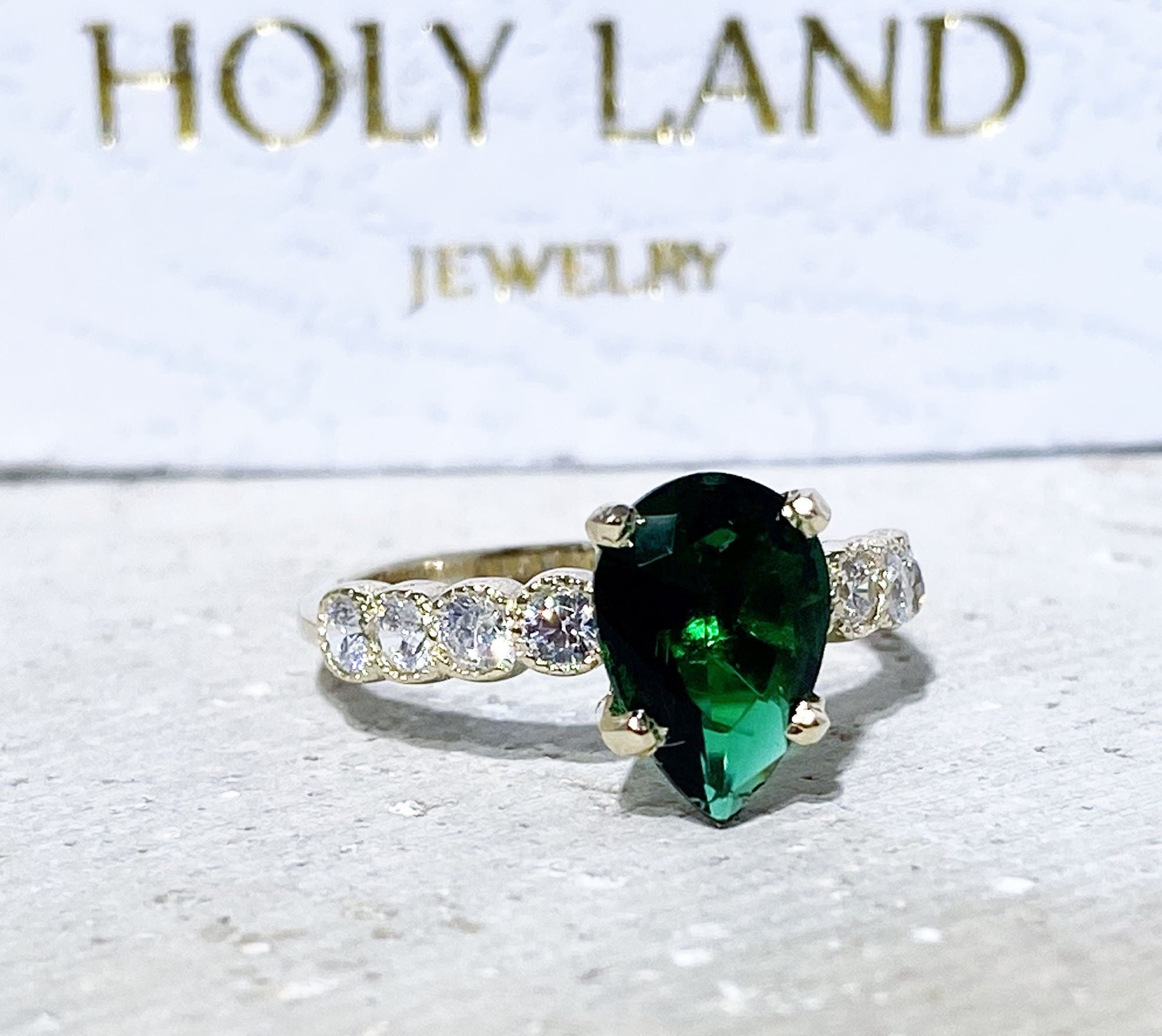 Emerald Ring - May Birthstone - Statement Engagement Ring with Pear-Shaped Emerald Gemstone and Clear Quartz Accents - H.L.Jewelry