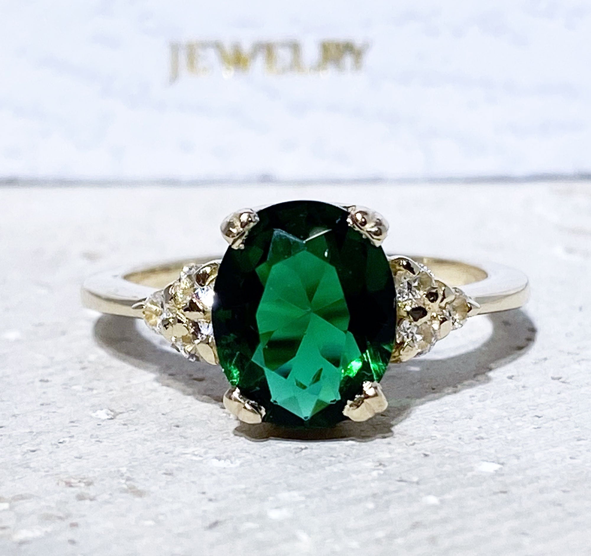 Emerald Ring - May Birthstone - Statement Engagement Ring with Oval Emerald Gemstone and Clear Quartz Accents - H.L.Jewelry