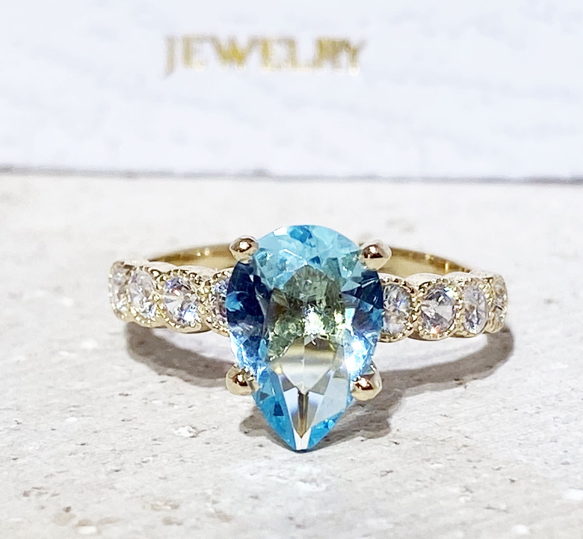 Aquamarine Ring - March Birthstone - Statement Engagement Ring with Pear-Shaped Aquamarine Gemstone and Clear Quartz Accents - H.L.Jewelry