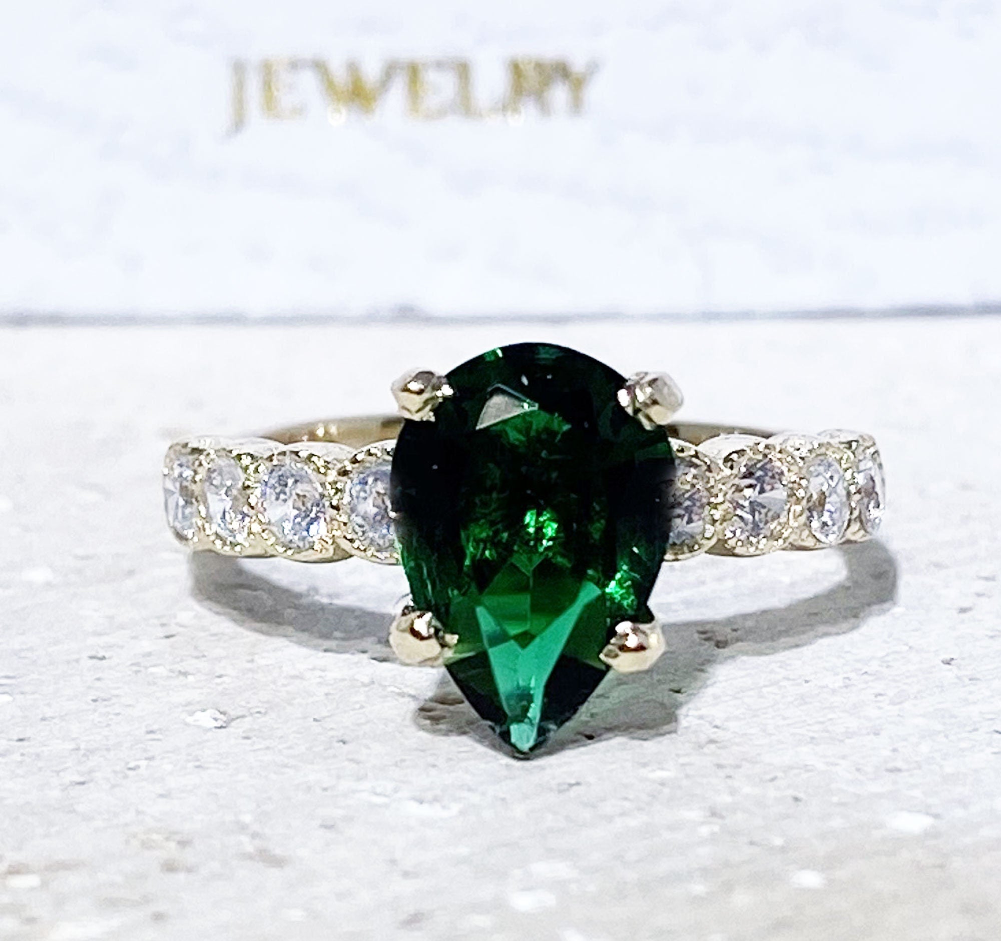 Emerald Ring - May Birthstone - Statement Engagement Ring with Pear-Shaped Emerald Gemstone and Clear Quartz Accents - H.L.Jewelry