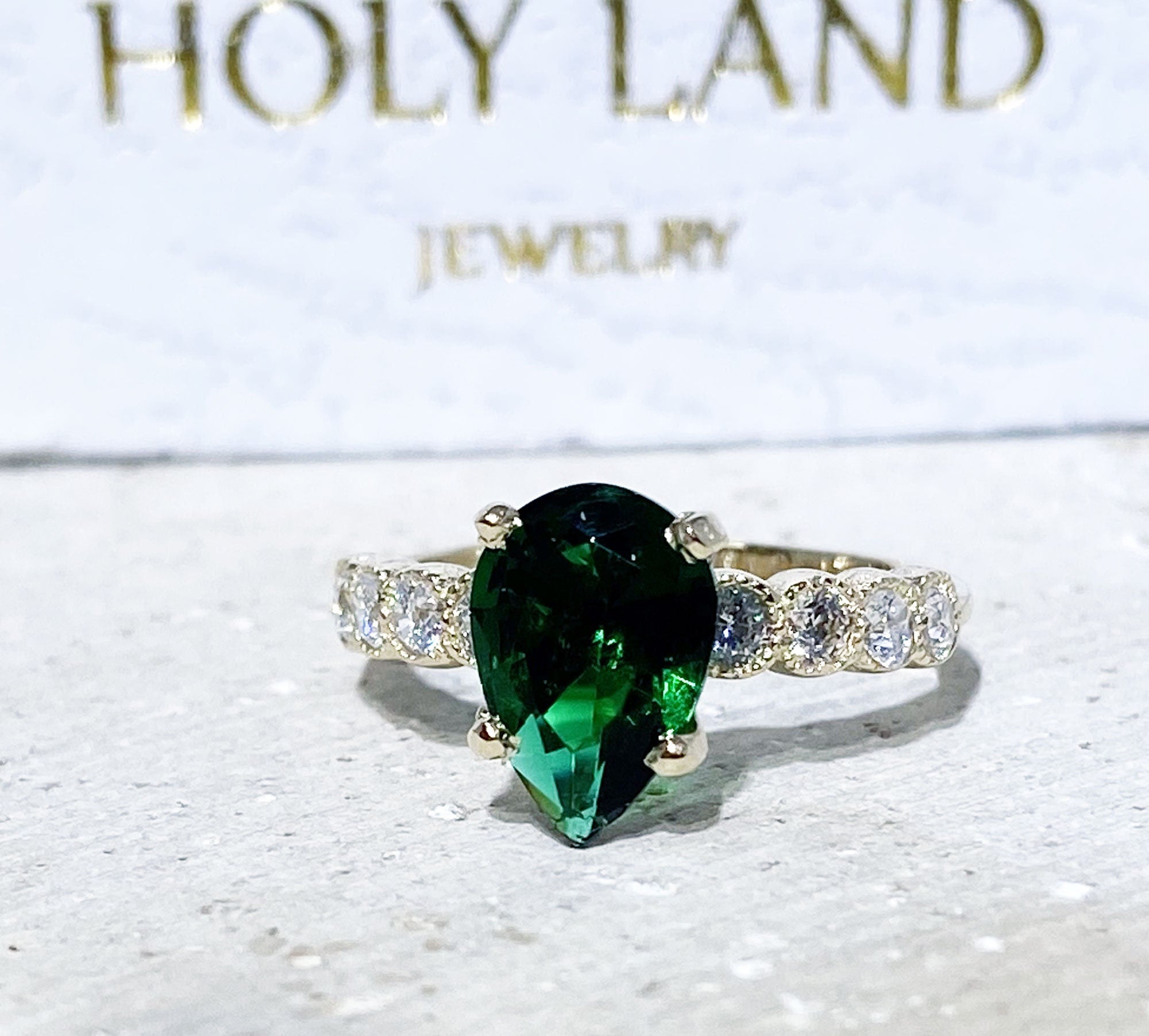 Emerald Ring - May Birthstone - Statement Engagement Ring with Pear-Shaped Emerald Gemstone and Clear Quartz Accents - H.L.Jewelry