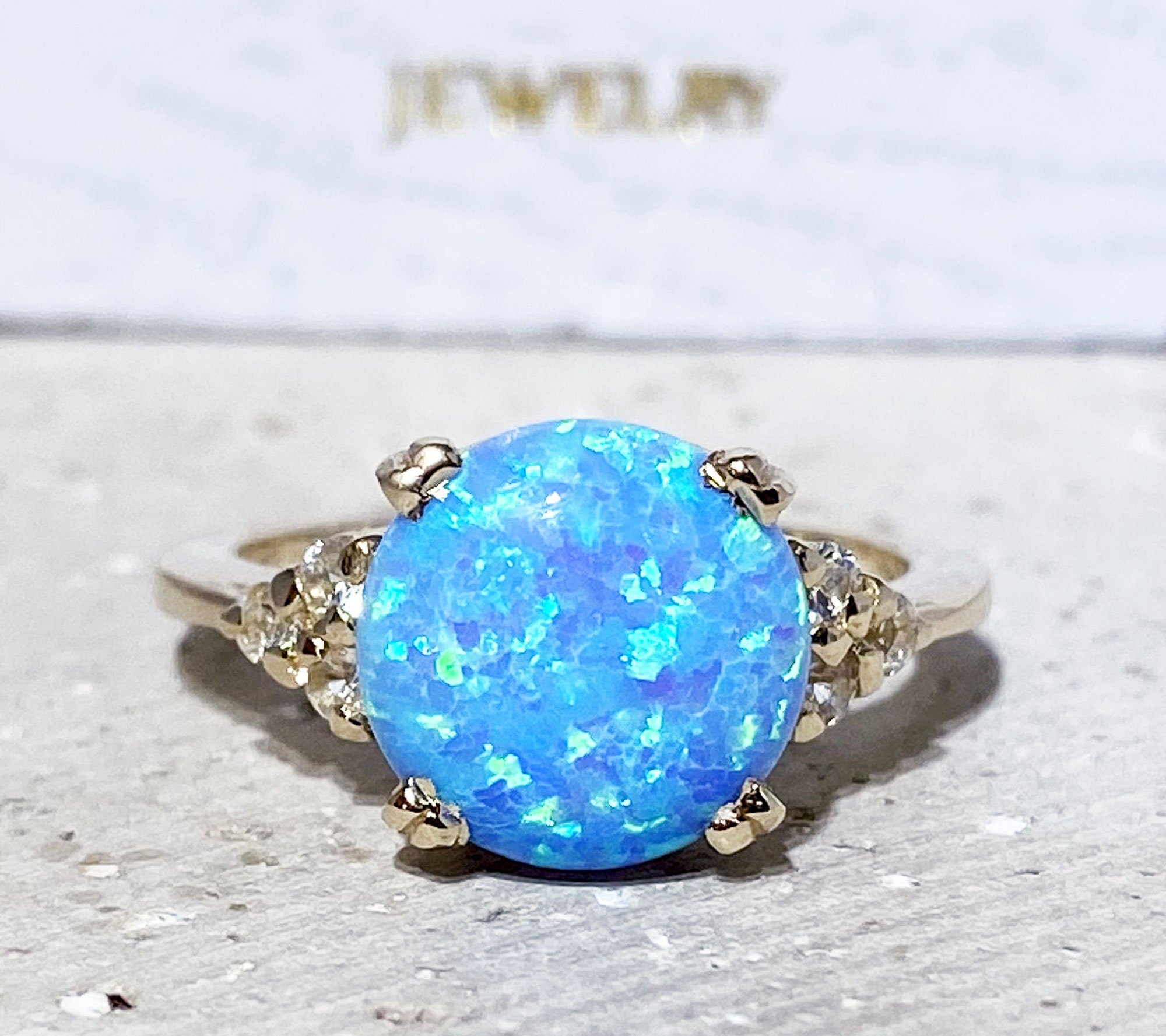 Blue Opal Ring - October Birthstone - Statement Engagement Ring with Round Blue Opal Middle Gemstone and Clear Quartz Accents - H.L.Jewelry