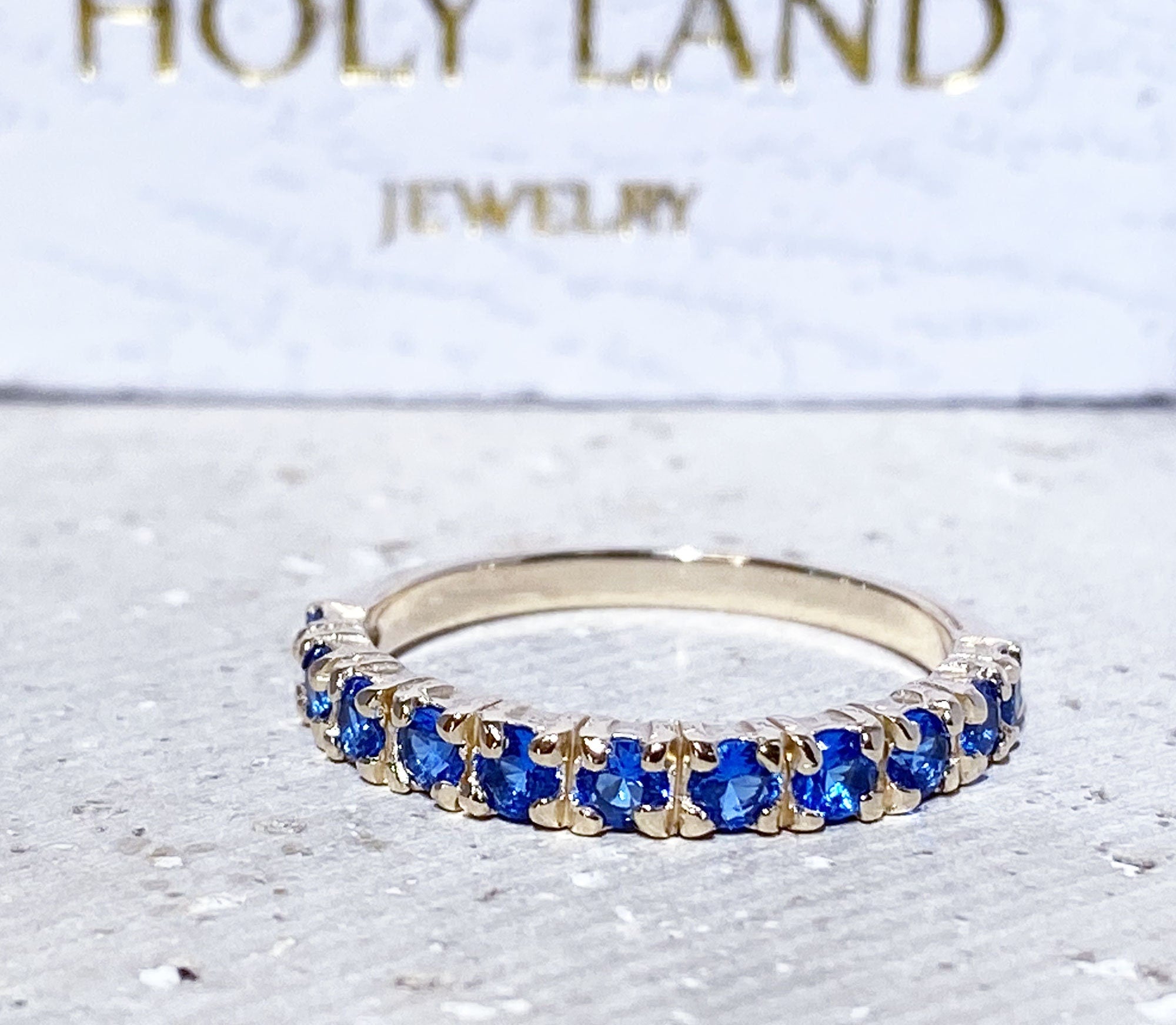 Blue Topaz Ring - December Birthstone - Delicate Stacking Half Eternity Ring with Eleven Round Blue Topaz Gemstones - H.L.Jewelry