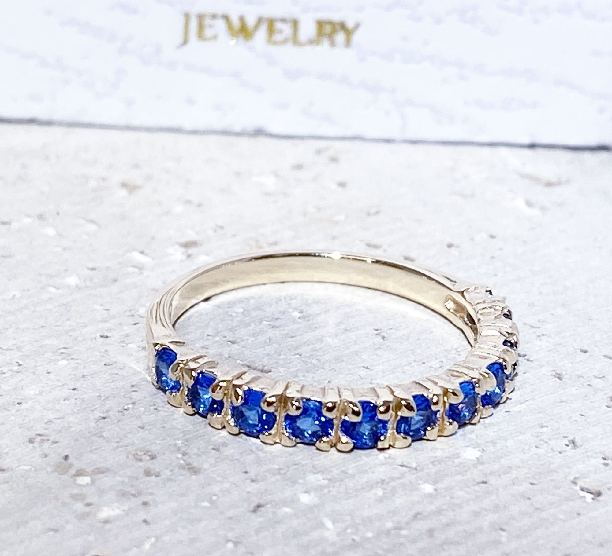 Blue Topaz Ring - December Birthstone - Delicate Stacking Half Eternity Ring with Eleven Round Blue Topaz Gemstones - H.L.Jewelry