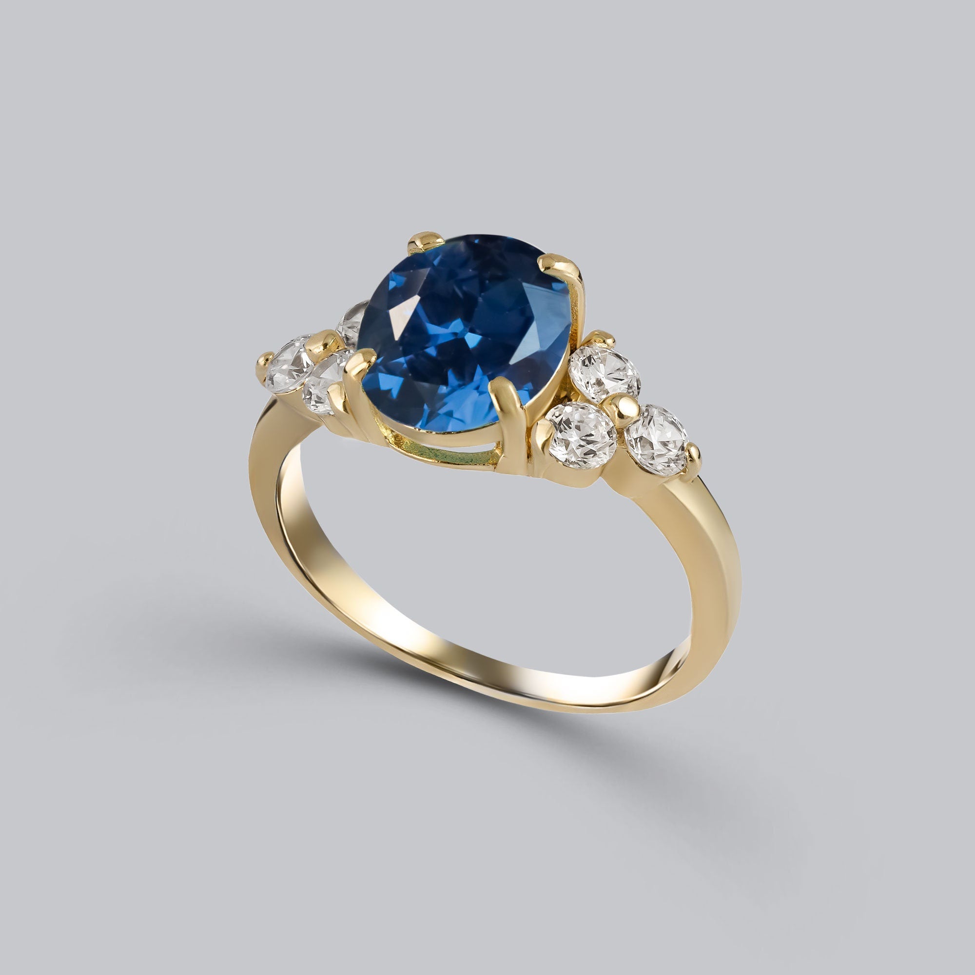 Blue Sapphire Ring - September Birthstone - Statement Engagement Ring with Oval Blue Sapphire Gemstone and Clear Quartz Accents - H.L.Jewelry