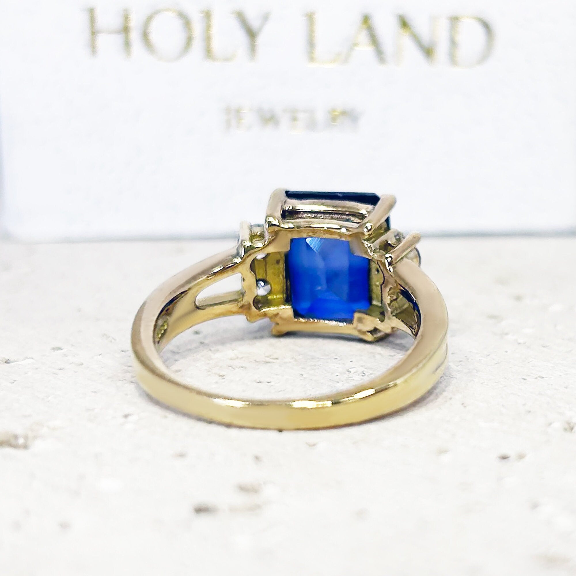 Blue Sapphire Ring - September Birthstone - Statement Engagement Ring with Emerald-Cut Blue Sapphire Gemstone and Clear Quartz Accents - H.L.Jewelry