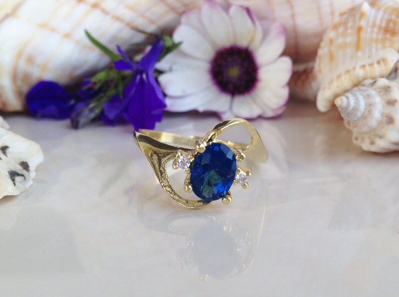 Blue Sapphire Ring - September Birthstone - Oval Blue Sapphire Ring with Clear Quartz Accents - H.L.Jewelry