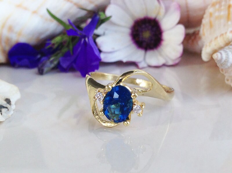 Blue Sapphire Ring - September Birthstone - Oval Blue Sapphire Ring with Clear Quartz Accents - H.L.Jewelry