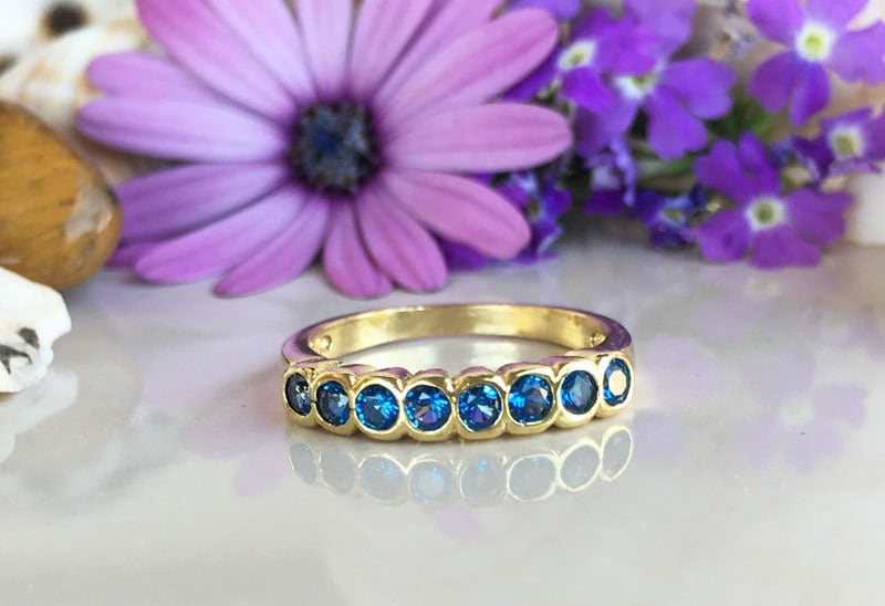 Blue Topaz Ring - December Birthstone - Stacking Ring with Eight Round Blue Topaz Gemstones - H.L.Jewelry