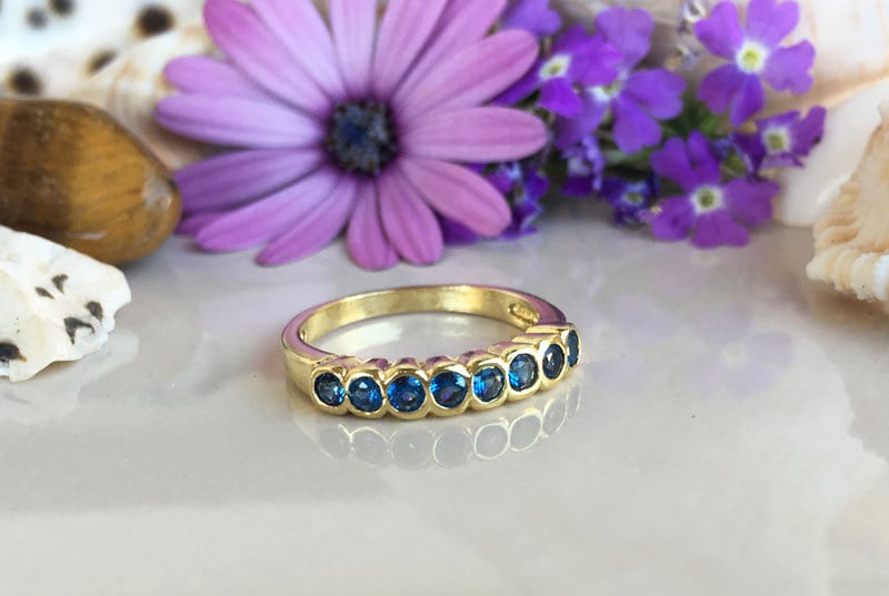 Blue Topaz Ring - December Birthstone - Stacking Ring with Eight Round Blue Topaz Gemstones - H.L.Jewelry